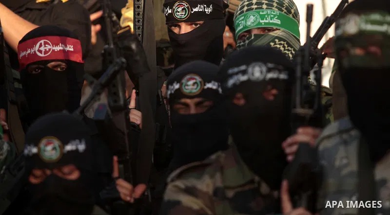 Palestinians militants from various armed factions, including Hamas, attend a news conference in Gaza City June 17, 2014. The news conference was held to protest against Israeli arrest of Palestinians in the West Bank as...