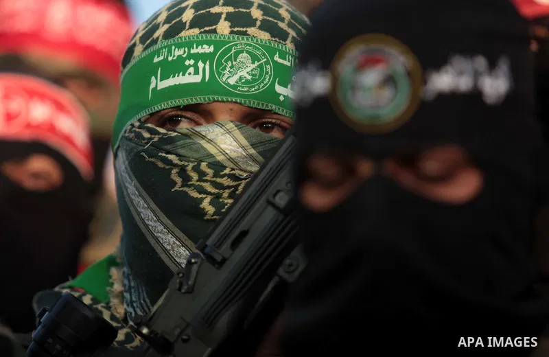 Palestinians militants from various armed factions, including Hamas, attend a news conference in Gaza City June 17, 2014. The news conference was held to protest against Israeli arrest of Palestinians in the West Bank as...