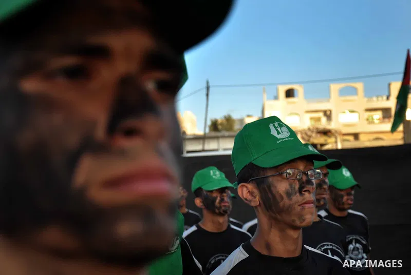 Palestinian children of the summer camps organized by Hamas movement, participate in a march to show solidarity with Palestinian prisoners held in Israeli jails, in Gaza City on June 18, 2014. Some 285 Palestinian prison...