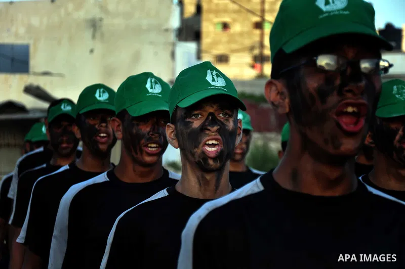Palestinian children of the summer camps organized by Hamas movement, participate in a march to show solidarity with Palestinian prisoners held in Israeli jails, in Gaza City on June 18, 2014. Some 285 Palestinian prison...