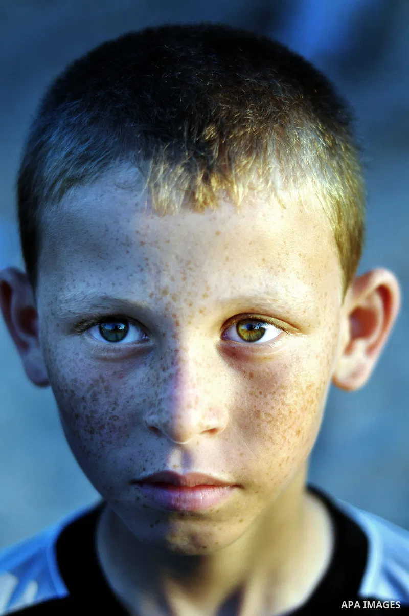 A Palestinian boy poses for a photograph as he participates in a march to show solidarity with Palestinian prisoners held in Israeli jails, in Gaza City on June 18, 2014. Some 285 Palestinian prisoners are observing a ma...