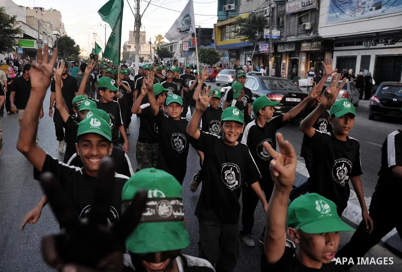 Palestinian children of the summer camps organized by Hamas movement, participate in a march to show solidarity with Palestinian prisoners held in Israeli jails, in Gaza City on June 18, 2014. Some 285 Palestinian prison...