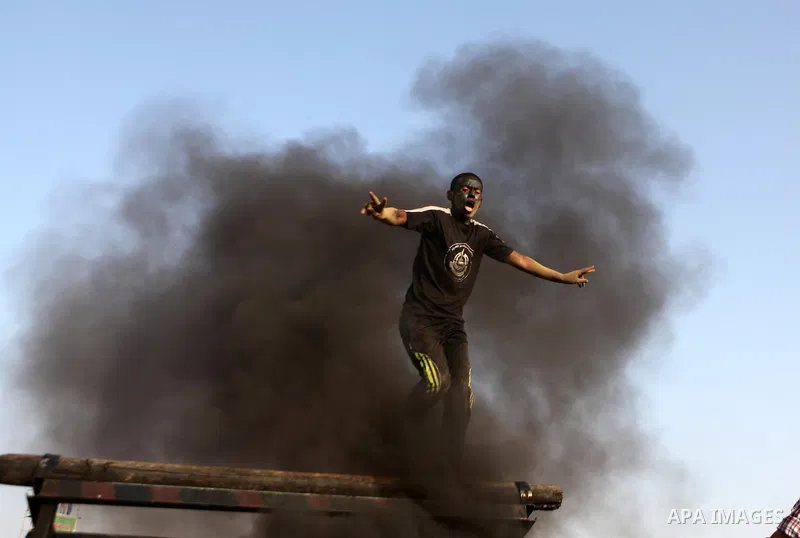 A Palestinian youth demonstrates his skills during a graduation ceremony of a military-style summer camp organized by the Hamas movement in Gaza City June 19, 2014. Hamas stages dozens of military-style summer camps for...