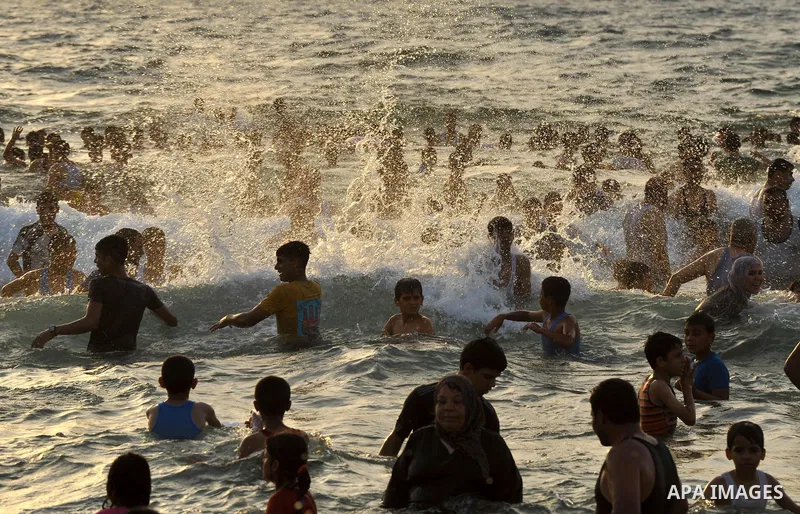 Palestinians enjoy the weekend at the beach of Gaza City June 20, 2014. Photo by Ezz al-Zanoun