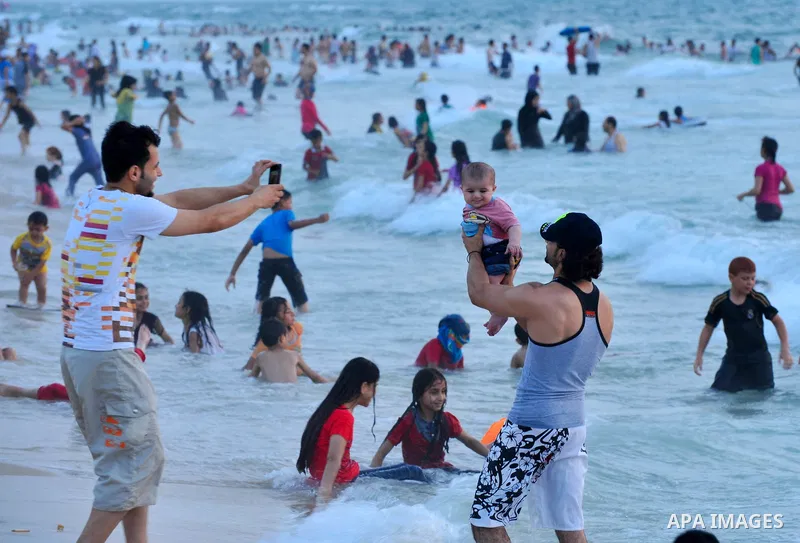 Palestinians enjoy the weekend at the beach of Gaza City June 20, 2014. Photo by Ezz al-Zanoun