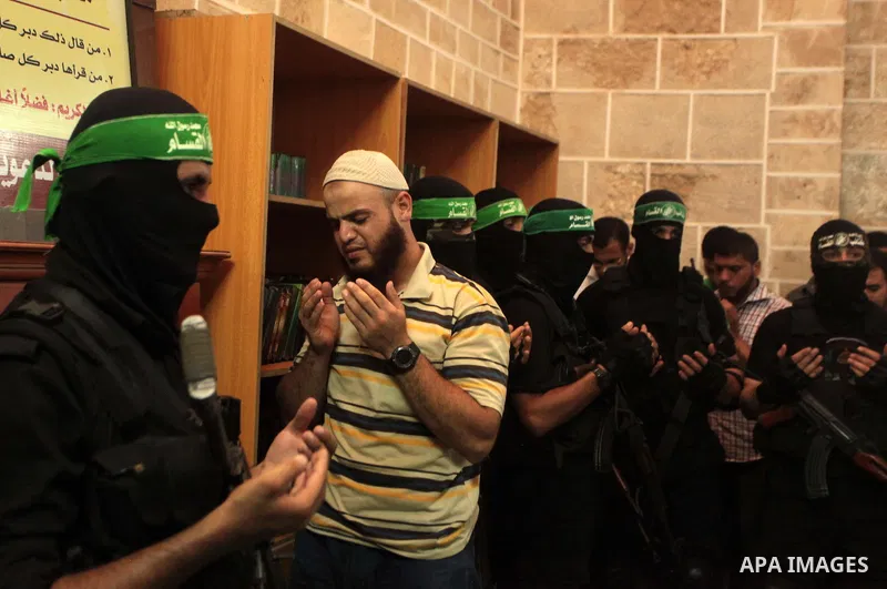 Mourners surround the bodies of Palestinian members of Hamas' armed wing during their funeral at a mosque in Gaza City June 21, 2014. Hamas' armed wing in Gaza said at least six members of its group were killed in the co...