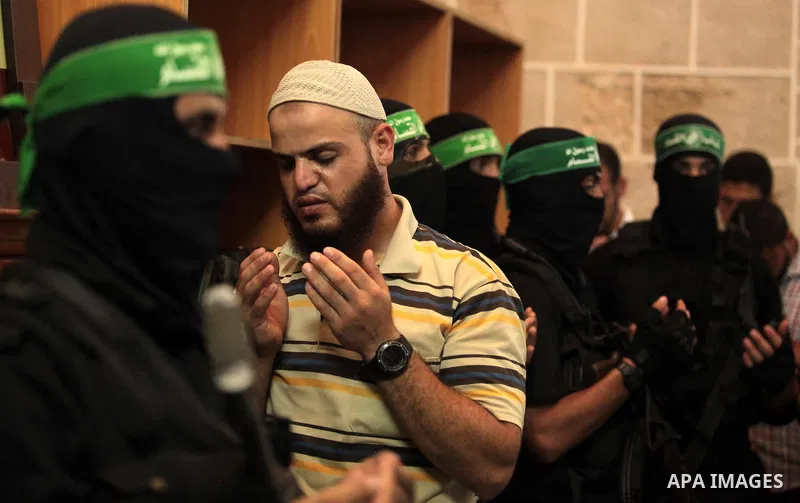 Mourners surround the bodies of Palestinian members of Hamas' armed wing during their funeral at a mosque in Gaza City June 21, 2014. Hamas' armed wing in Gaza said at least six members of its group were killed in the co...