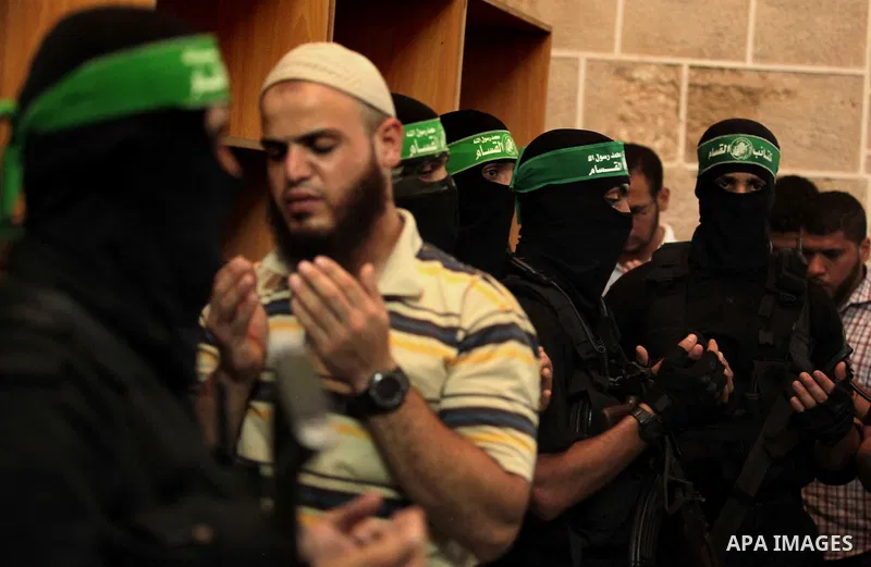 Mourners surround the bodies of Palestinian members of Hamas' armed wing during their funeral at a mosque in Gaza City June 21, 2014. Hamas' armed wing in Gaza said at least six members of its group were killed in the co...
