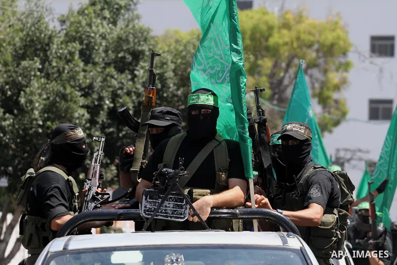 Palestinian members of the Ezzedine al-Qassam Brigades, the military wing of Hamas, attend the funeral of comrades who died two days ago after an explosion caused the collapse of a tunnel under the Israeli border, on Jun...