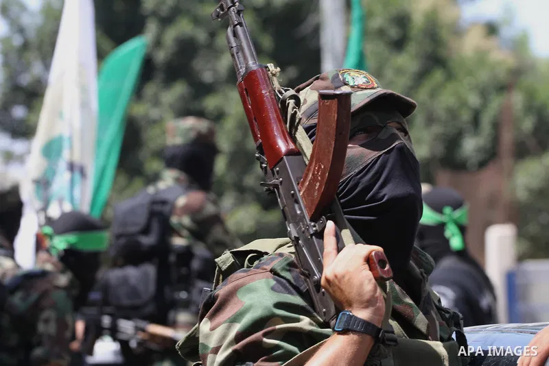 Palestinian members of the Ezzedine al-Qassam Brigades, the military wing of Hamas, attend the funeral of comrades who died two days ago after an explosion caused the collapse of a tunnel under the Israeli border, on Jun...