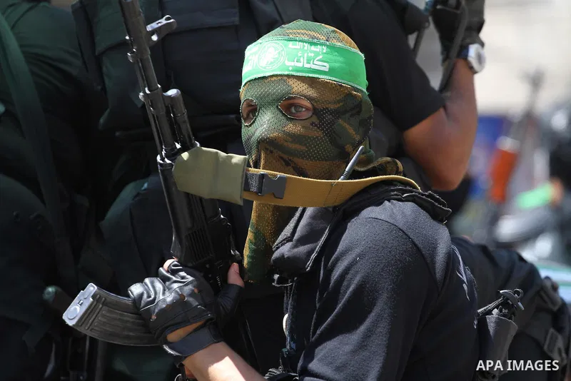 Palestinian members of the Ezzedine al-Qassam Brigades, the military wing of Hamas, attend the funeral of comrades who died two days ago after an explosion caused the collapse of a tunnel under the Israeli border, on Jun...