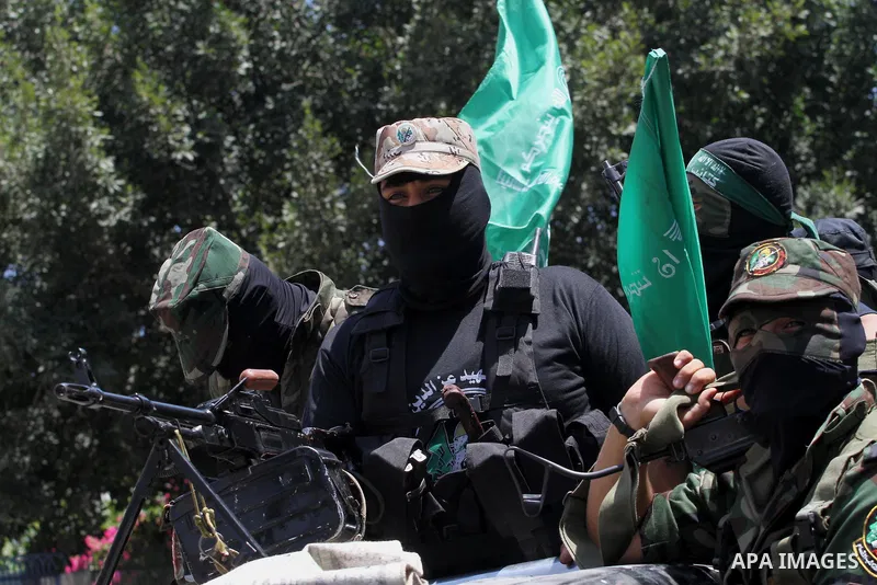 Palestinian members of the Ezzedine al-Qassam Brigades, the military wing of Hamas, attend the funeral of comrades who died two days ago after an explosion caused the collapse of a tunnel under the Israeli border, on Jun...