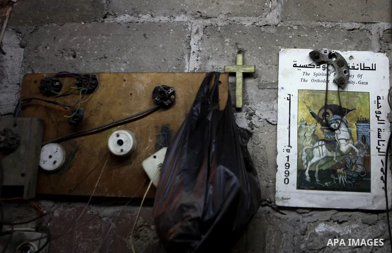 An elderly Palestinian man owns old instruments at his home in Gaza city on June 21, 2014. Photo by Ezz Zanoun