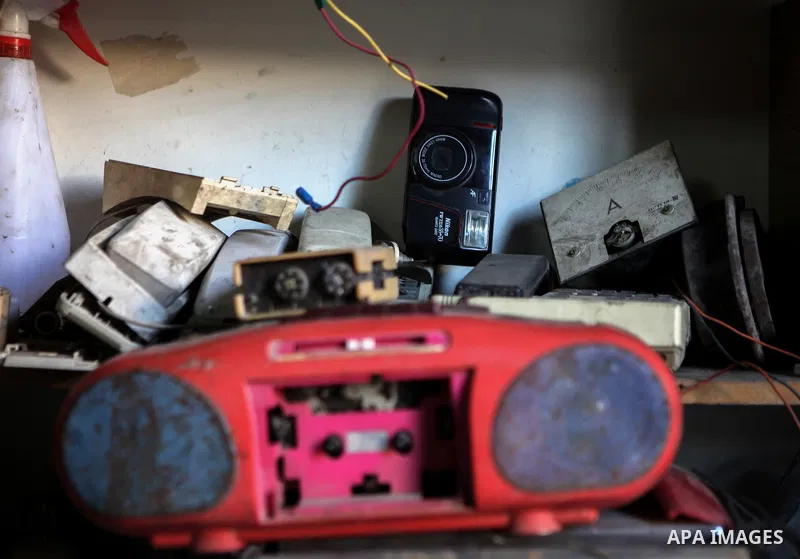 An elderly Palestinian man owns old instruments at his home in Gaza city on June 21, 2014. Photo by Ezz Zanoun