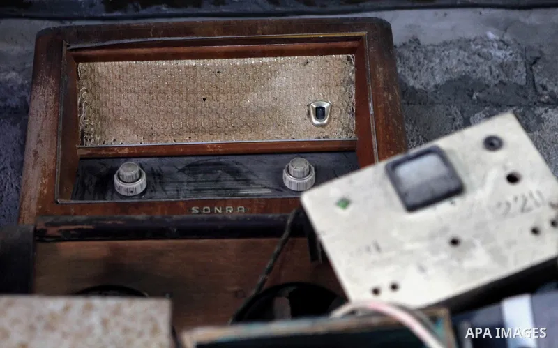 An elderly Palestinian man owns old instruments at his home in Gaza city on June 21, 2014. Photo by Ezz Zanoun