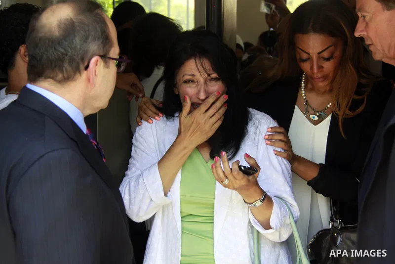 Wafa Bassiouni, mother of Mohamed Fahmy cry during the sentencing session at a courtroom in Cairo, Egypt, 23 June 2014. Three Al Jazeera journalists were jailed for seven years in Egypt on Monday after a court convicted...