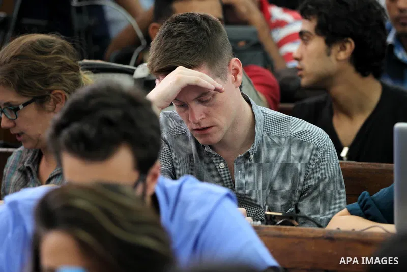 Relatives of Al Jazeera journalists attend the sentencing session at a courtroom in Cairo, Egypt, 23 June 2014. Three Al Jazeera journalists were jailed for seven years in Egypt on Monday after a court convicted them of...