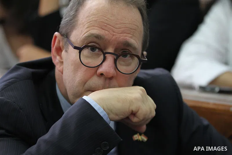 The Canadian ambassador to Egypt, David Drake, attends the sentencing hearing for journalists working for Al-Jazeera in a courtroom in Cairo, Egypt, Monday, June 23, 2014. An Egyptian court on Monday convicted three jour...