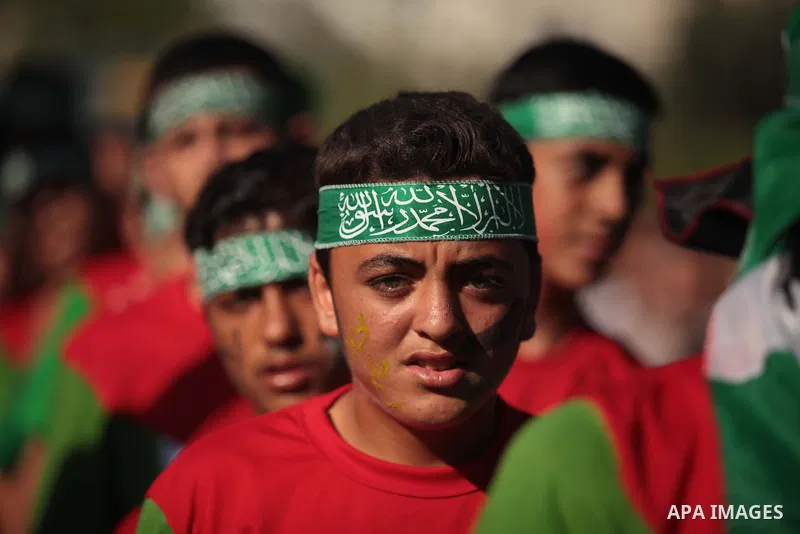 Palestinian children take part in a rally in solidarity with the hunger-striking Palestinian prisoners held by Israel, in Jabalia refugee camp in the northern Gaza Strip, June 24, 2014. Nearly 300 Palestinian prisoners h...