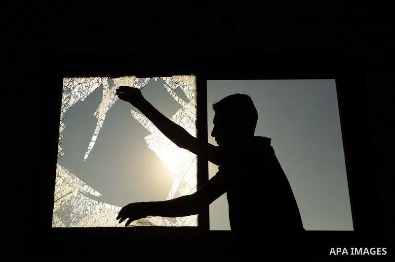 A Palestinian man inspects a chicken coop damaged in an Israeli air strike in Khan Younis in the southern Gaza Strip June 25, 2014. Militants in the Gaza Strip, a coastal enclave where Hamas is dominant and has vowed rev...