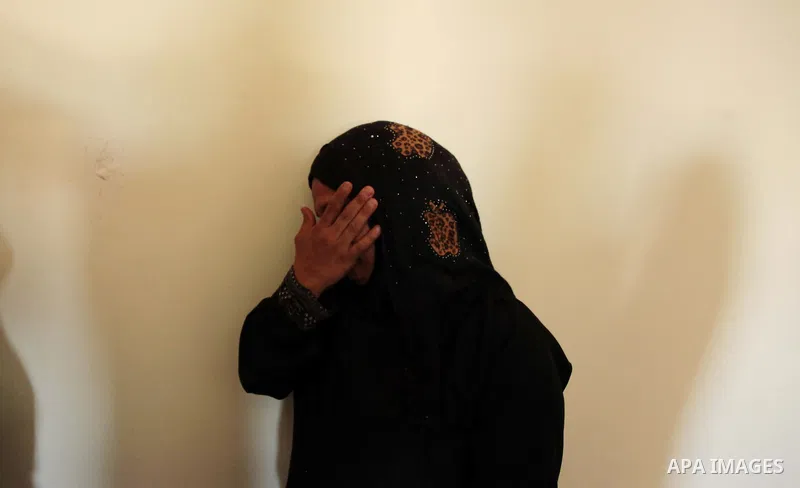 A relative of three-year-old Palestinian girl Jud al-Danaf mourns during her funeral, in Gaza City June 25, 2014. The Gaza girl was killed and three of her family were wounded in an explosion which residents blamed on Is...