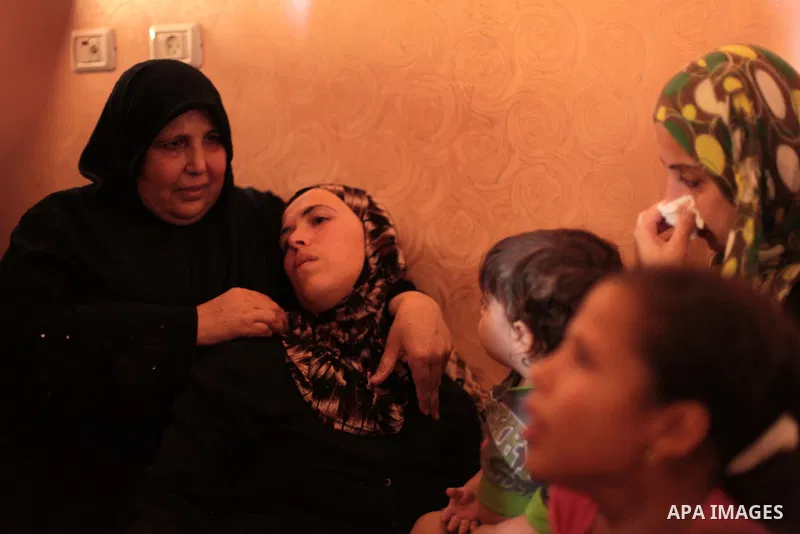 The mother of three-year-old Palestinian girl Jud al-Danaf mourns during her funeral, in Gaza City June 25, 2014. The Gaza girl was killed and three of her family were wounded in an explosion which residents blamed on Is...