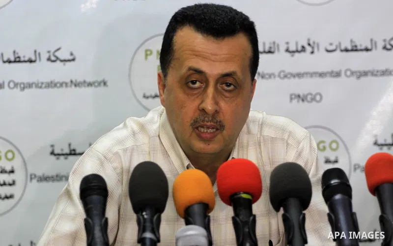 A Palestinian member of the Network of NGOs speaks during a press conference in Gaza city on June 25, 2014. Photo by Mohammed Asad
