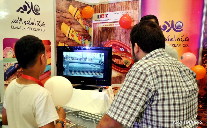 Palestinians take part in the Palestinian food exhibition, organized by the general union of Palestinian industries, in Gaza City on June 25, 2014. Photo by Mohammed Talatene