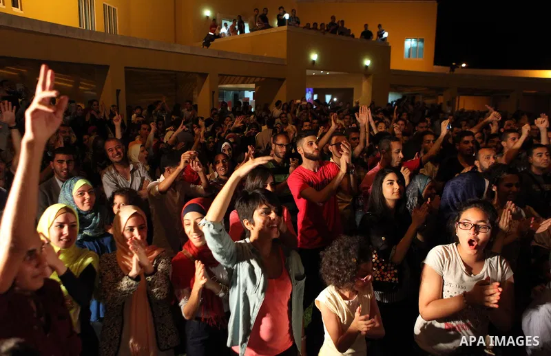 Palestinians take part in a concert in the courtyard of the French Cultural Center in Gaza City, on June 24, 2014. Photo by Ezz Zanoun