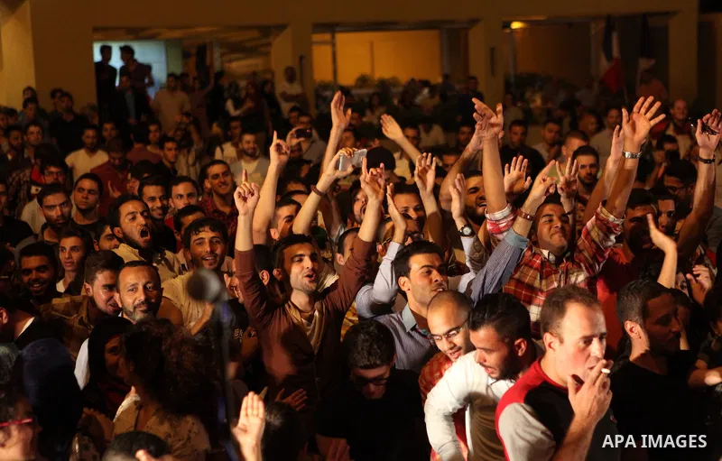 Palestinians take part in a concert in the courtyard of the French Cultural Center in Gaza City, on June 24, 2014. Photo by Ezz Zanoun