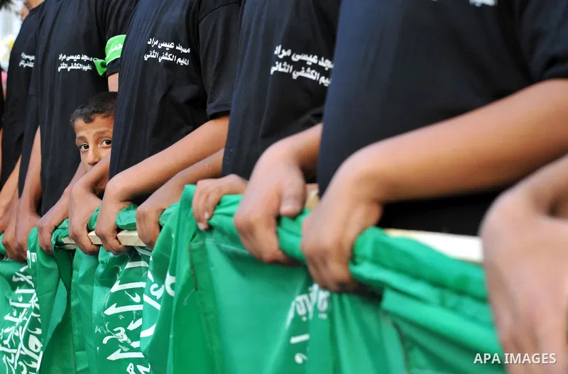 Palestinian children take part in a rally in solidarity with prisoners in Israeli jails and against the Israeli search operation for three missing Israeli teenagers in the West Bank, in Gaza City on June 25, 2014. Israel...