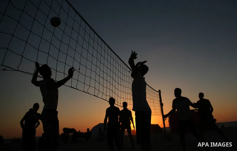 Palestinians enjoy a day on the beach in the central Gaza Strip June 26, 2014. Palestinian Environment Quality Authority said in a statement the pollution of the seawater has gone beyond 50 percent. The lack of enough fu...