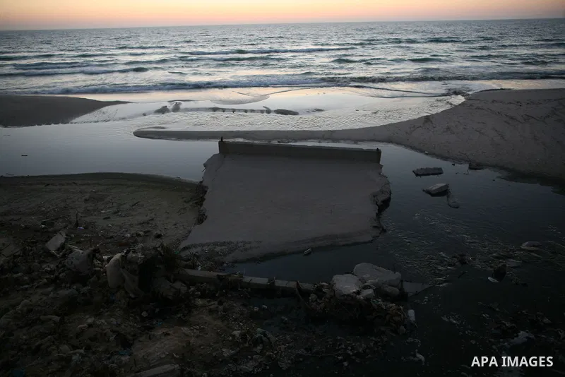 The sewage water is seen pour in the sea on the beach in the central Gaza Strip June 26, 2014. Palestinian Environment Quality Authority said in a statement the pollution of the seawater has gone beyond 50 percent. The l...