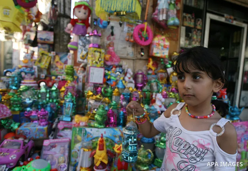 A Palestinian girl carries a traditional Ramadan lantern marking the holy month of Ramadan at a market in Rafah in the southern Gaza Strip, June 26, 2014. Muslims observe the dawn-to-dusk fasting during the holy month of...