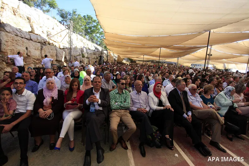 Palestinians attend a graduation ceremony of Birzeit University students near the West Bank city of Ramallah, June 26, 2014 . Photo by Issam Rimawi