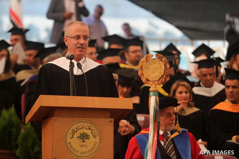 Palestinian Prime Minister Rami Hamdallah speaks during a graduation ceremony of Birzeit University students near the West Bank city of Ramallah, June 26, 2014 . Photo by Issam Rimawi