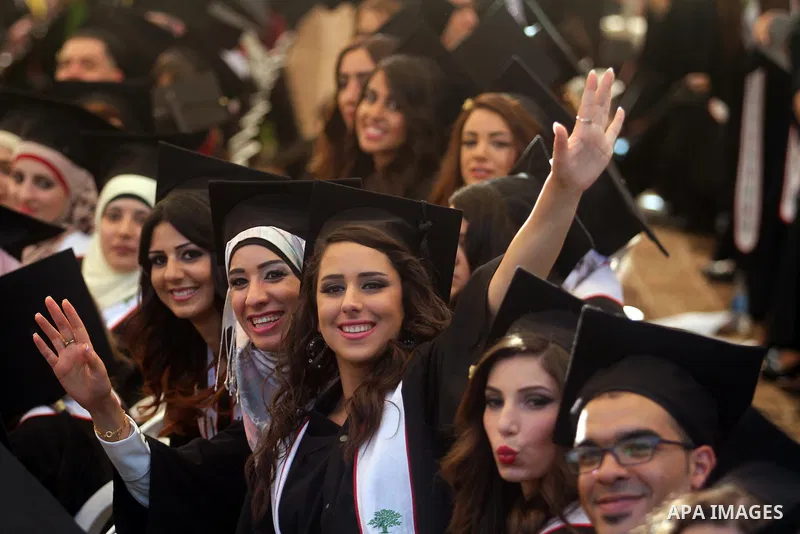 Palestinian students attend their graduation ceremony at the Birzeit University near the West Bank city of Ramallah, June 26, 2014. Photo by Issam Rimawi