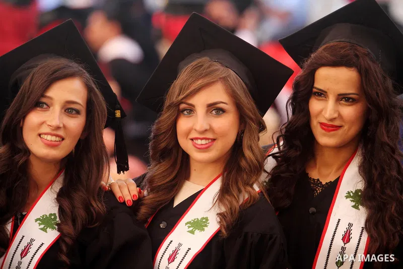 Palestinian students attend their graduation ceremony at the Birzeit University near the West Bank city of Ramallah, June 26, 2014. Photo by Issam Rimawi