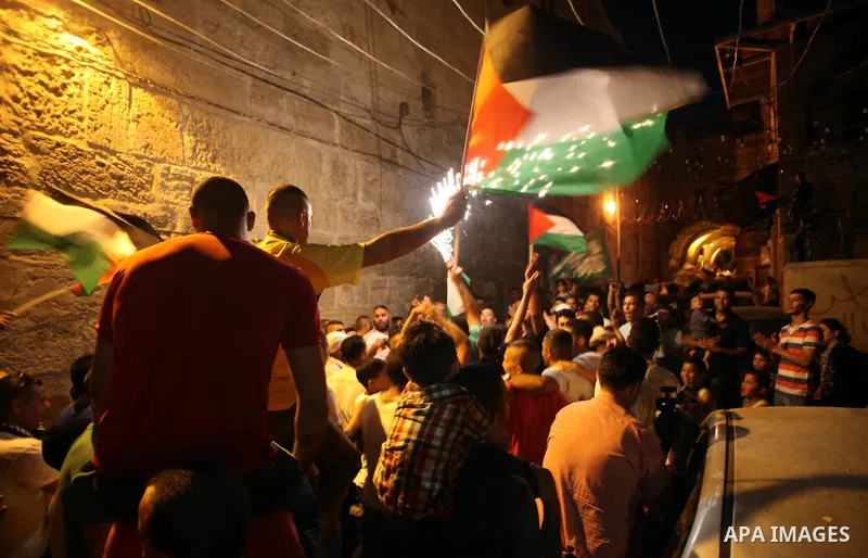 Palestinian prisoner Wissam kashur, 34, is greeted by people as he celebrates his release from an Israeli jail in Jerusalem on June 26, 2014. Israel freed Kashur from jail on Thursday, after spent twelve years in its pri...