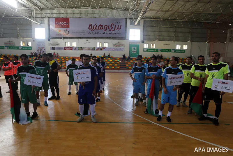 Palestinian football players participate in a match the during the championship of ''Gaza World Cup", in an event against the Israeli blockade on Gaza Strip, in Gaza City on June 27, 2014. Palestinians share a billion or...