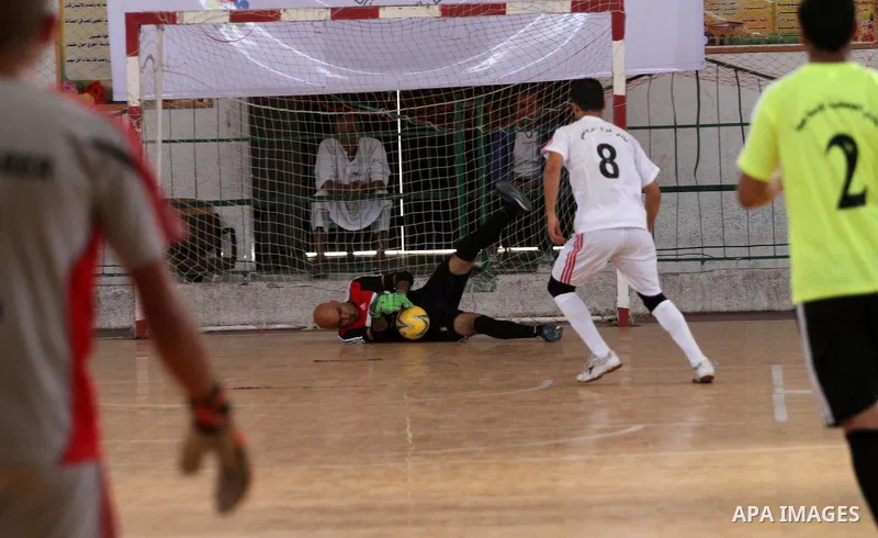 Palestinian football players participate in a match the during the championship of ''Gaza World Cup", in an event against the Israeli blockade on Gaza Strip, in Gaza City on June 27, 2014. Palestinians share a billion or...