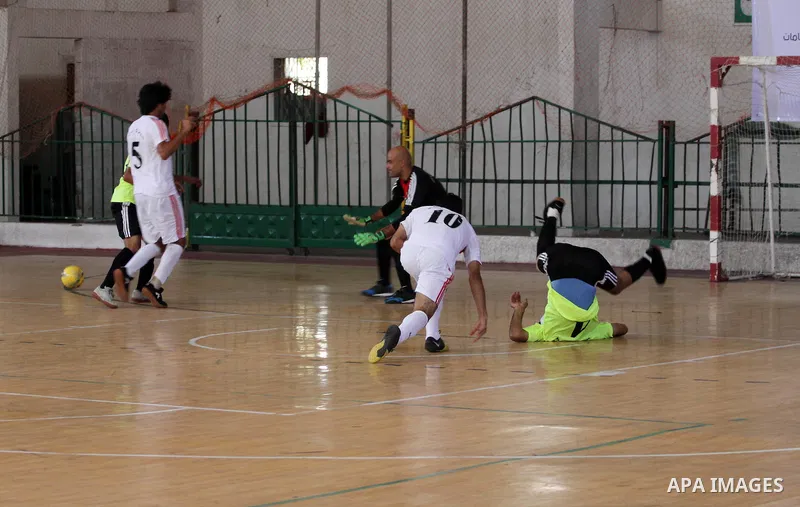 Palestinian football players participate in a match the during the championship of ''Gaza World Cup", in an event against the Israeli blockade on Gaza Strip, in Gaza City on June 27, 2014. Palestinians share a billion or...