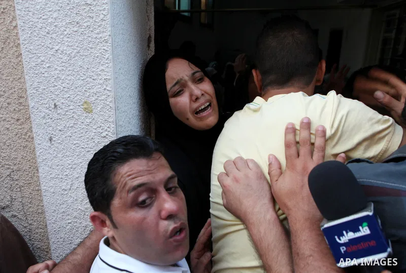 A Palestinian relative of Mohammed al-Faseeh, 24, mourns during his funeral in Gaza City on June 27, 2014. An Israeli air strike killed two Palestinian militants and critically wounded a third in the Gaza Strip on Friday...