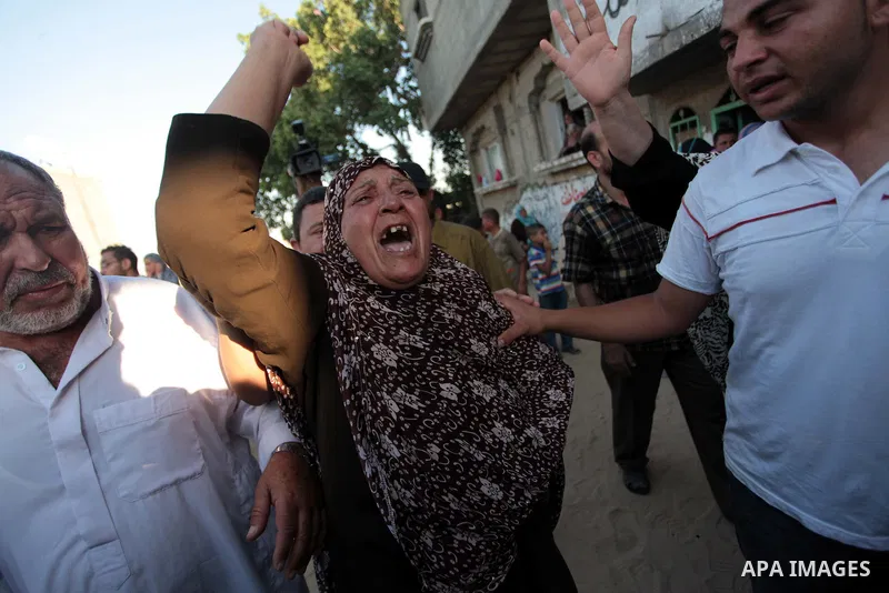 A Palestinian relative of Osama al-Hosomi mourns during his funeral in the northern Gaza Strip June 27, 2014. An Israeli air strike killed two Palestinian militants, one of them al-Hosomi, and critically wounded a third...