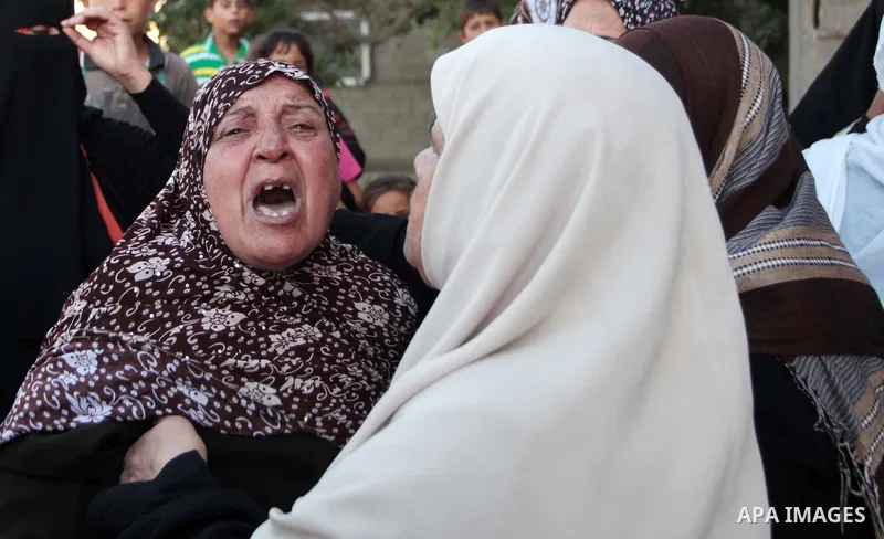 A Palestinian relative of Osama al-Hosomi mourns during his funeral in the northern Gaza Strip June 27, 2014. An Israeli air strike killed two Palestinian militants, one of them al-Hosomi, and critically wounded a third...