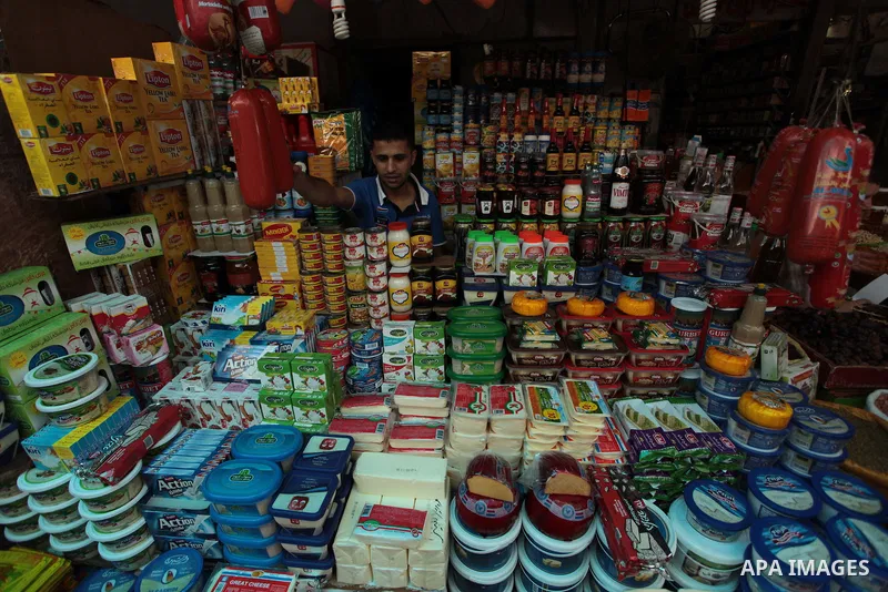 A Palestinian man sells foods in his shop at a market in Gaza City, as Muslims prepare for the upcoming holy fasting month of Ramadan, on June 28, 2014. on the eve of the start of the Muslim holy month of Ramadan. During...