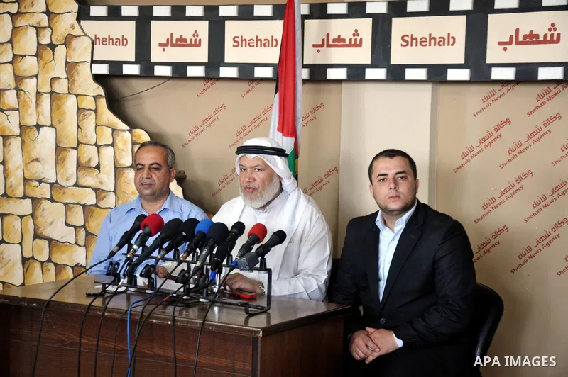 Palestinian head of the Parliamentary Committee of the Legislative Council, Marwan Abu Ras speaks during a press conference in Gaza City, on June 28, 2014. Photo by Mohammed Talatene