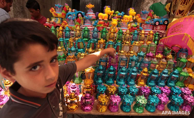 A Palestinian vendor sells a traditional Ramadan lantern in his shop at a market in Gaza City, as Muslims prepare for the upcoming holy fasting month of Ramadan, on June 28, 2014. on the eve of the start of the Muslim ho...
