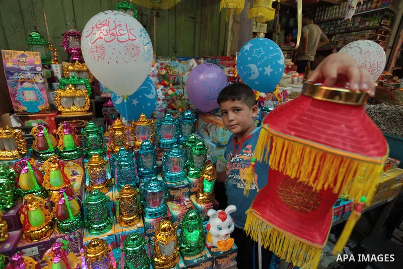 A Palestinian boy carries a traditional Ramadan lantern at a market in Gaza City, as Muslims prepare for the upcoming holy fasting month of Ramadan, on June 28, 2014. on the eve of the start of the Muslim holy month of R...