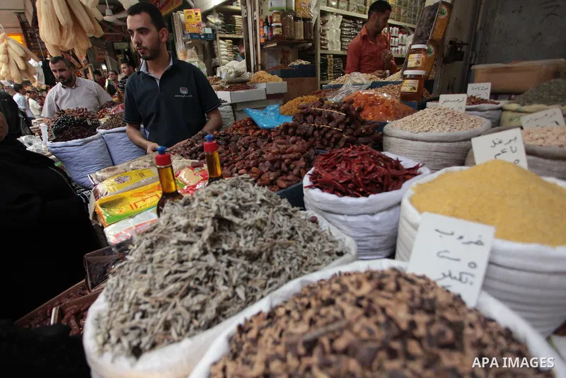 A Palestinian man sells spices in her shop at a market in Gaza City, as Muslims prepare for the upcoming holy fasting month of Ramadan, on June 28, 2014. on the eve of the start of the Muslim holy month of Ramadan. Durin...